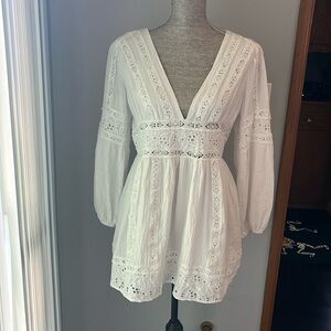 Revolve white eyelet dress brand Vici
Size Medium excellent condition